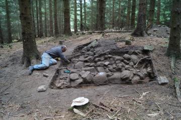 Brian, our smallest member of the team trying to further the well excavation