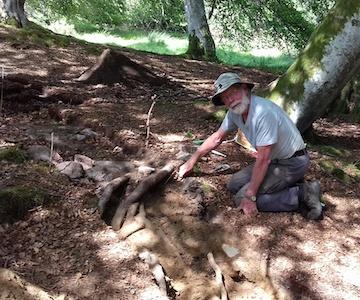 Volunteer Andrew Wainwright digging in one of the trenches